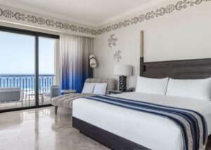 picture of a room with double bed and sea view balcony