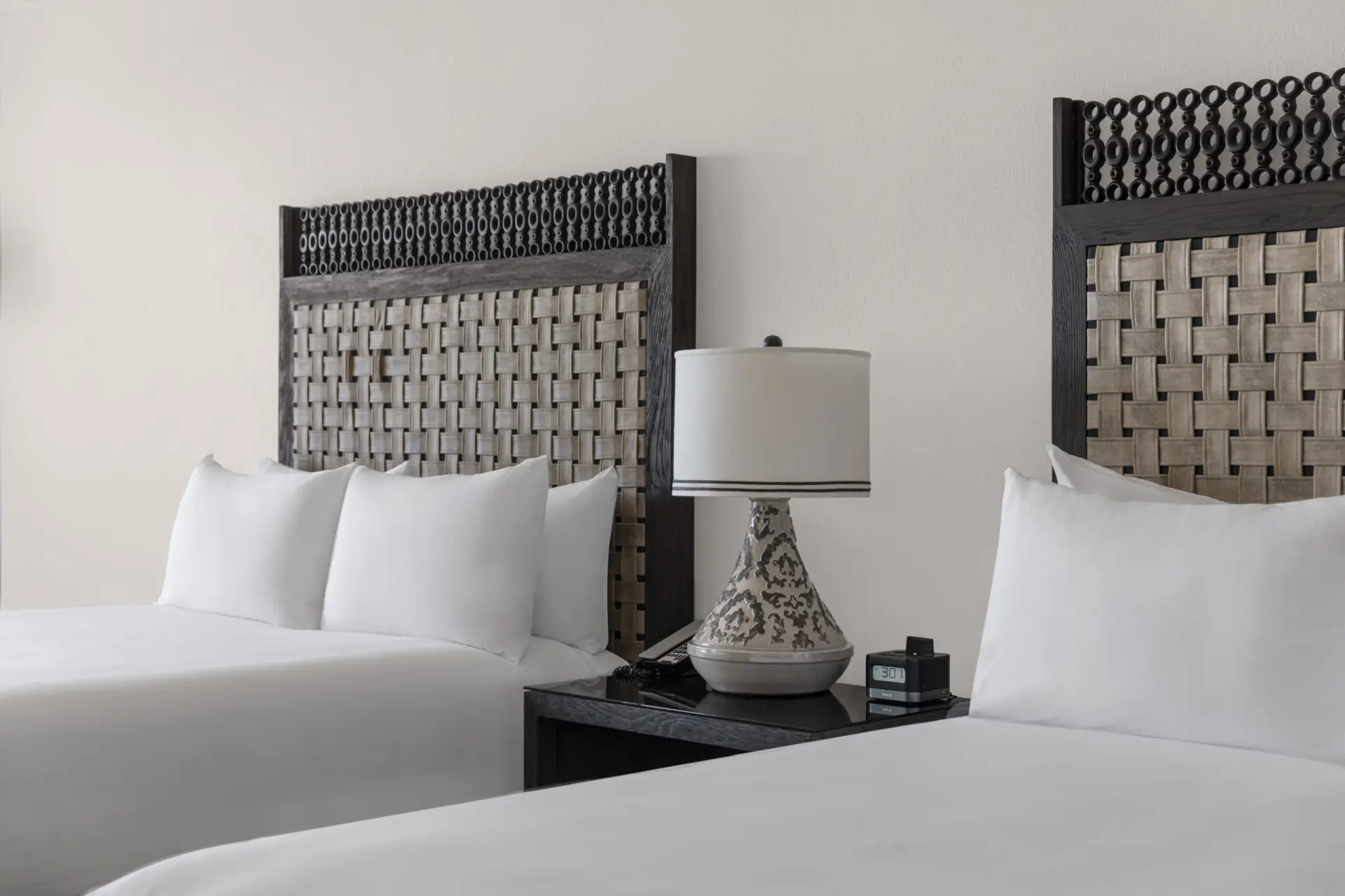 picture of two single beds with side table in between