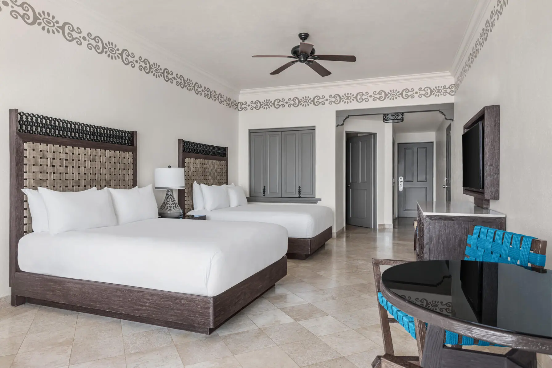 picture of a room with two double beds