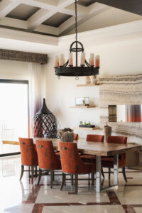 picture of dining table with chairs and hanging beautiful lights