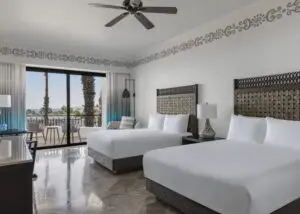 picture of two double beds and sea view balcony