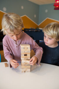 picture of two boys playing jenga