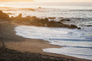picture of sea waves and big stones on the beach