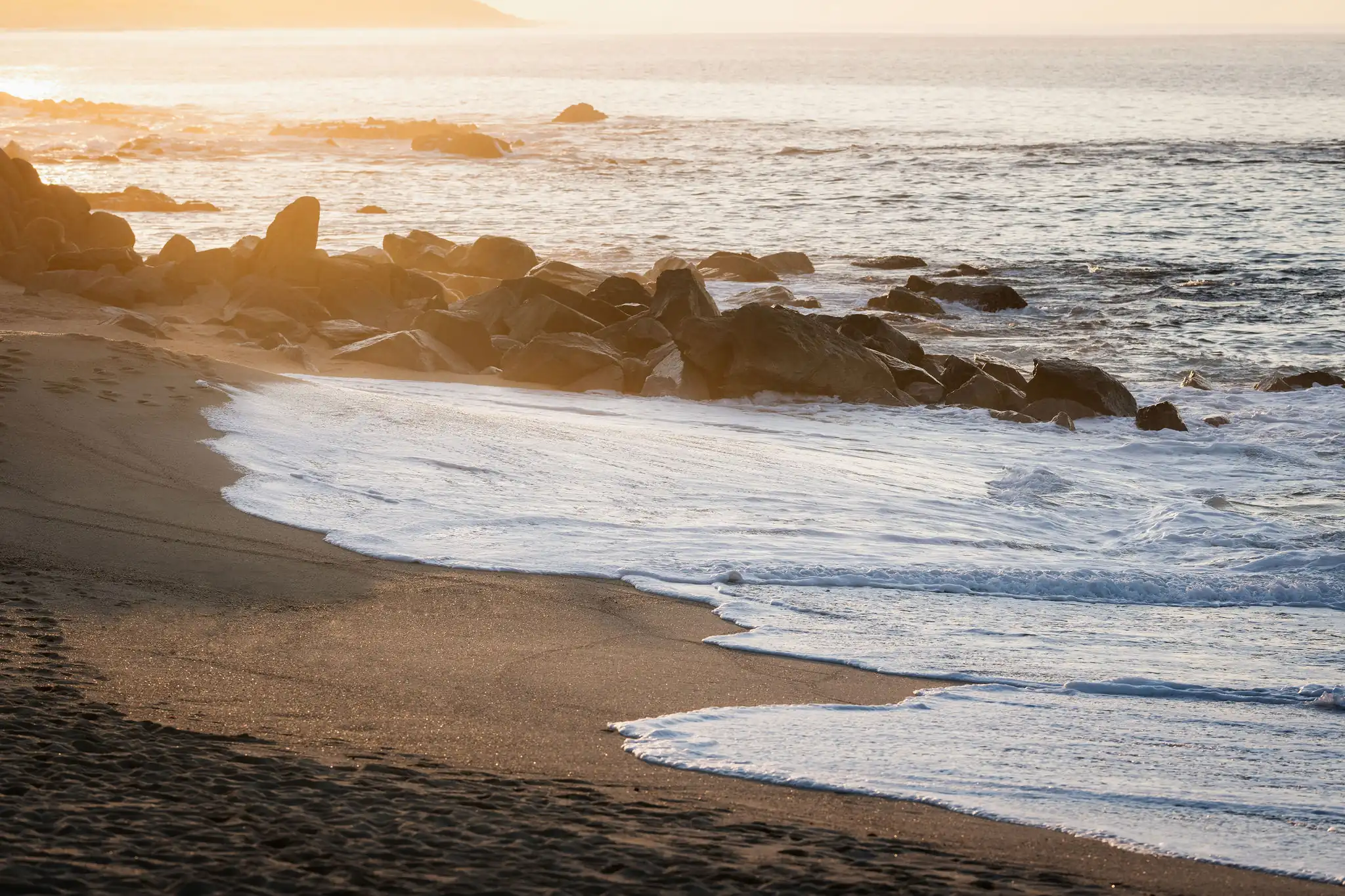 picture of sea waves and big stones on the beach