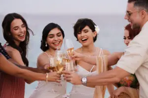 picture of people holding glasses and cheering