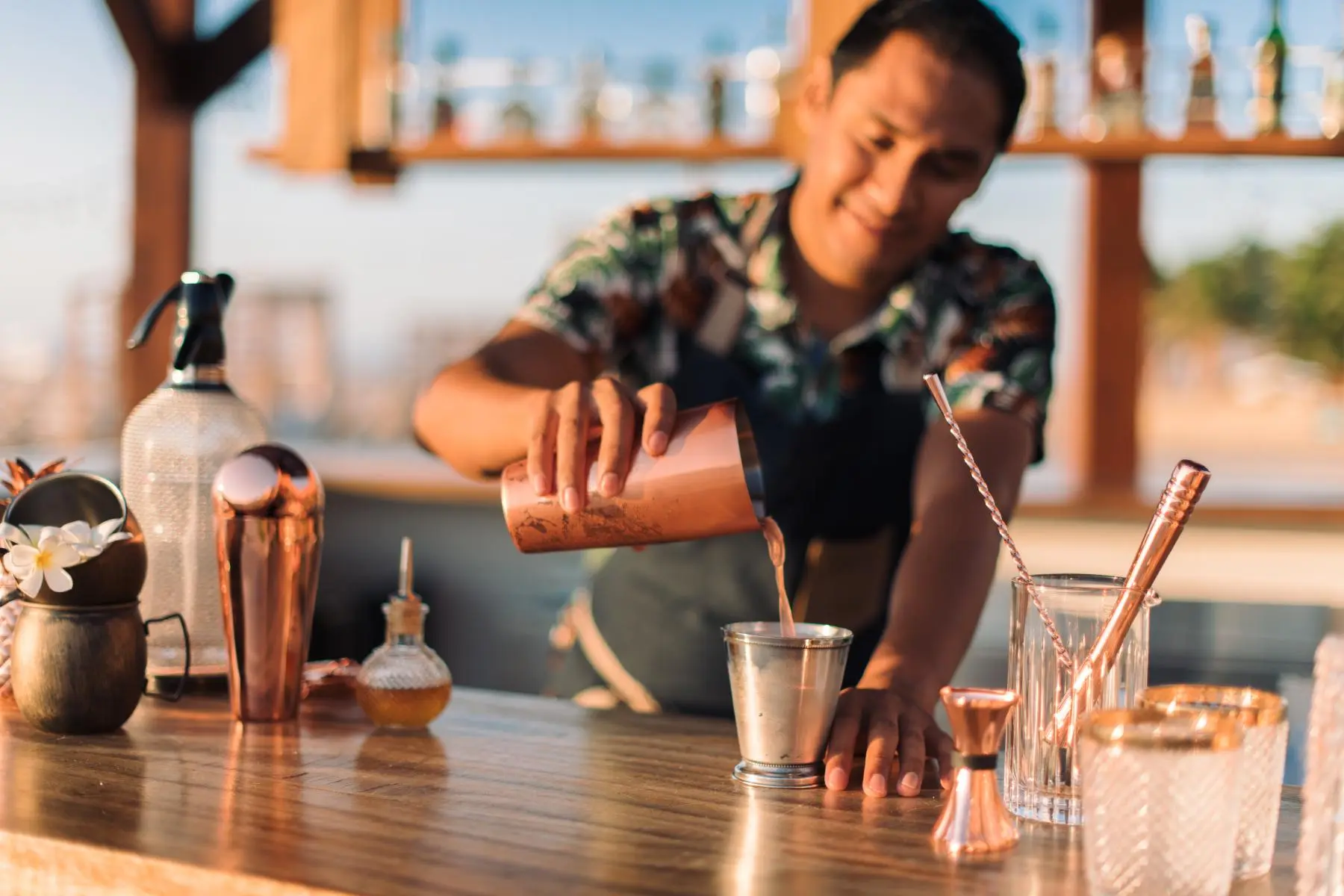 picture of a bartender serving drinking