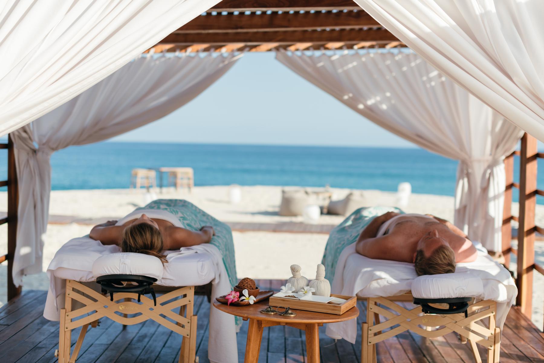 picture of the massage clients in an open area with a sea view