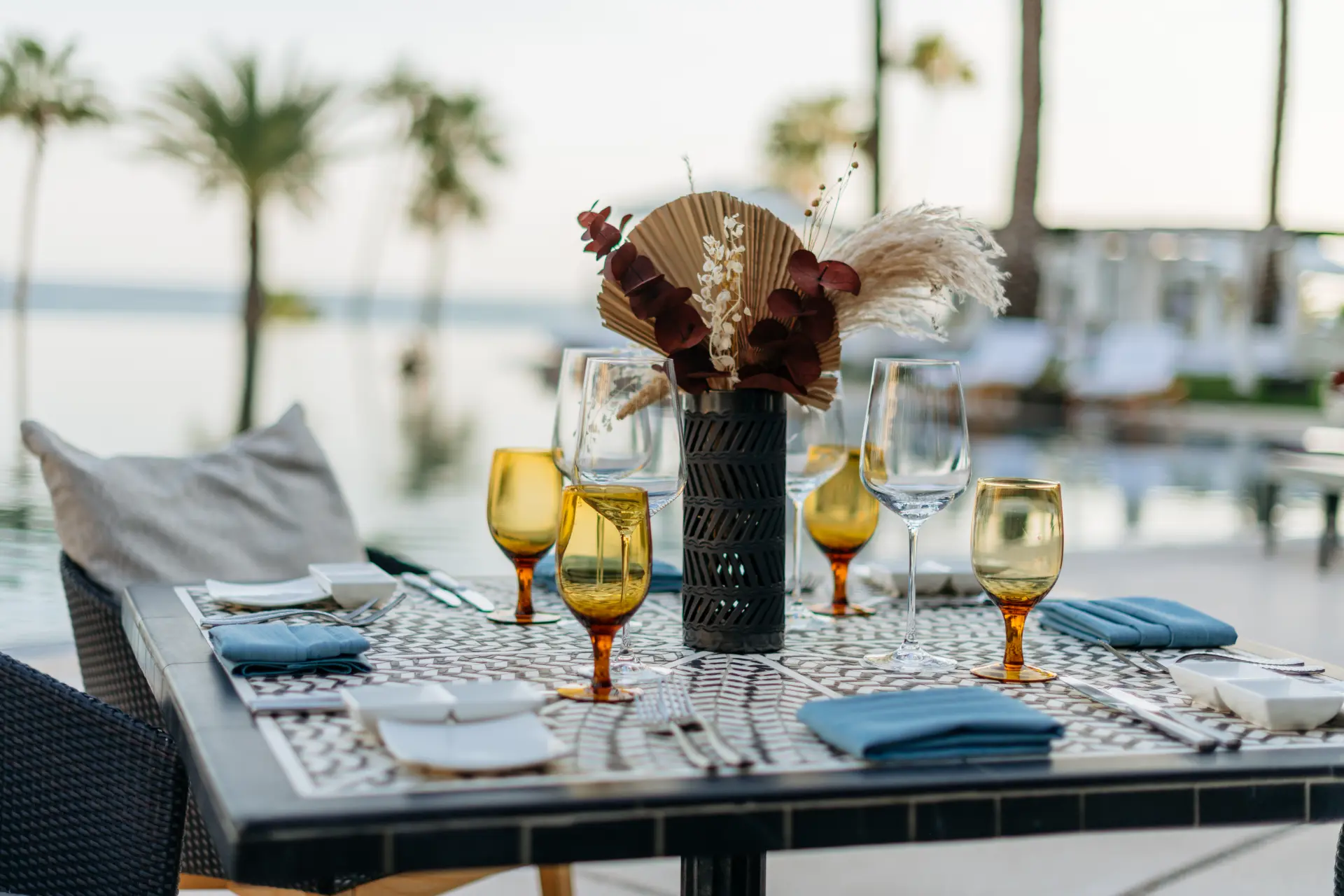 picture of a table setup with glasses and napkins
