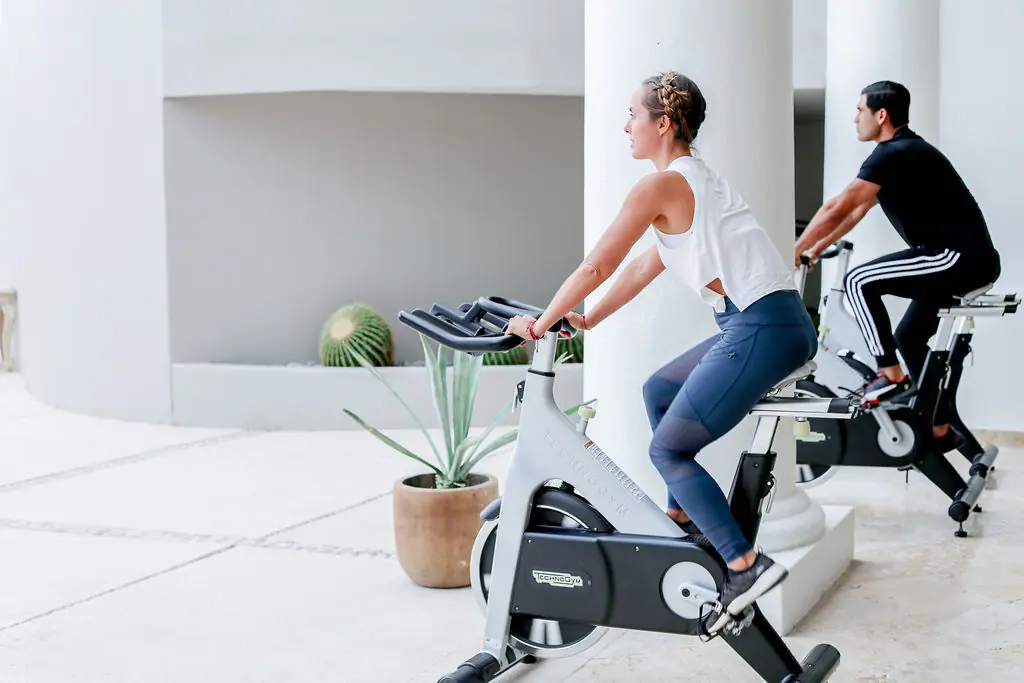picture of two people working out in garden surrounding area
