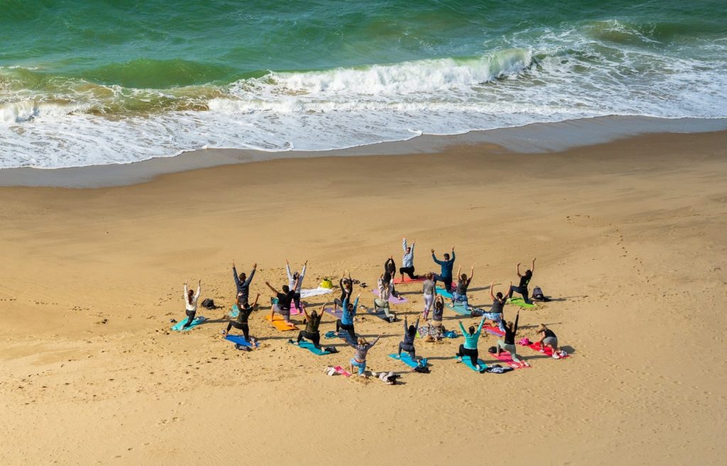 Picture of a people doing exercise on the beach